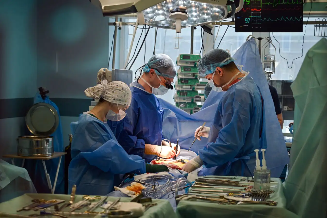 Surgeons performing heart surgery