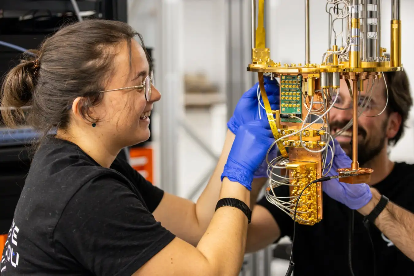 Two quantum engineers working on one of the systems at Qilimanjaro?s multimodal quantum data center.