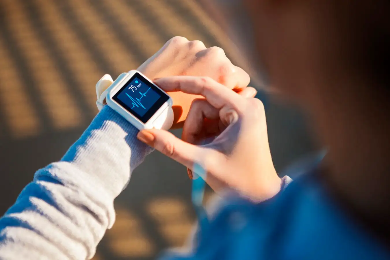 Someone reading their heart rate monitor.