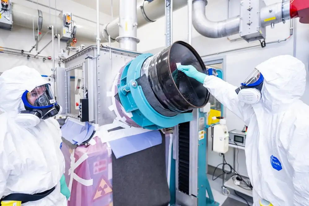 Scientists making radioactive drugs in a lab