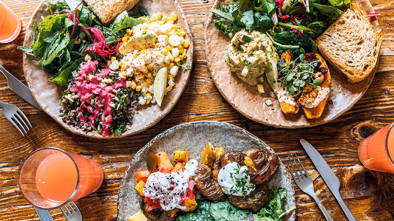 Plates of various foods on a table..