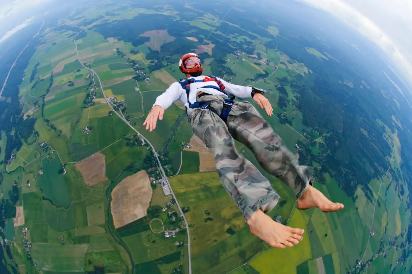 A skydiver, skydiving