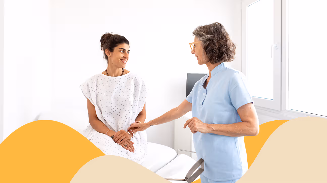 Female sitting in an exam room with a female doctor