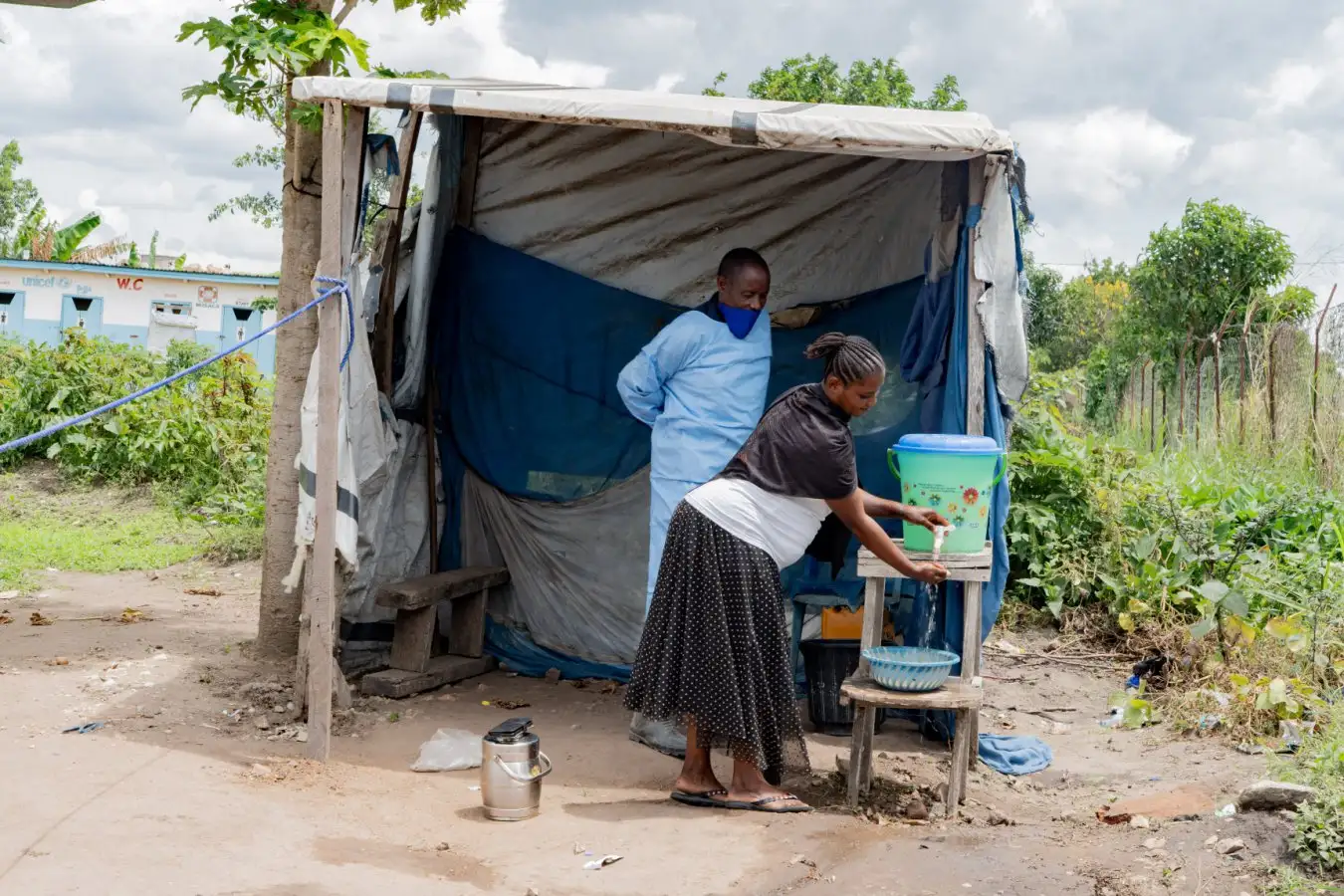 A health worker instructs a local resident to wash their hands in Rwampara, Democratic Republic of the Congo, on 16 May, amid the Ebola outbreak