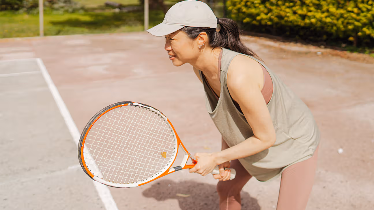 Mid-life female playing tennis