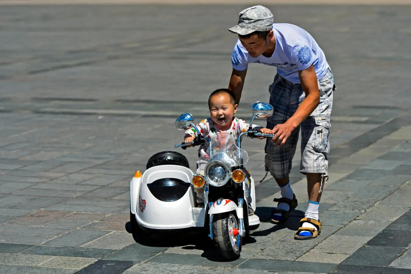 A father playing with their child