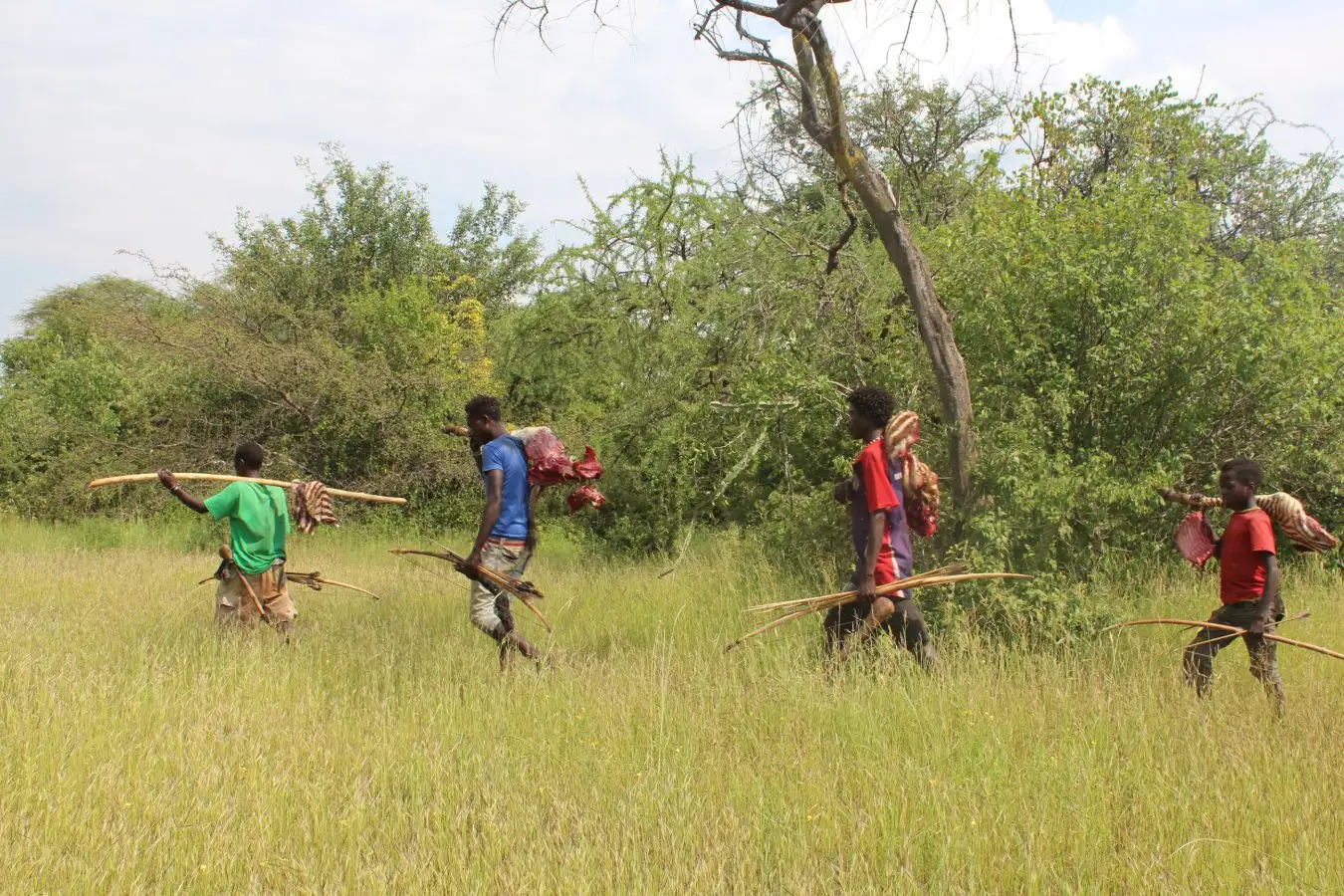 People from the Hadza hunter gatherer population in Tanzania, after a hunt
