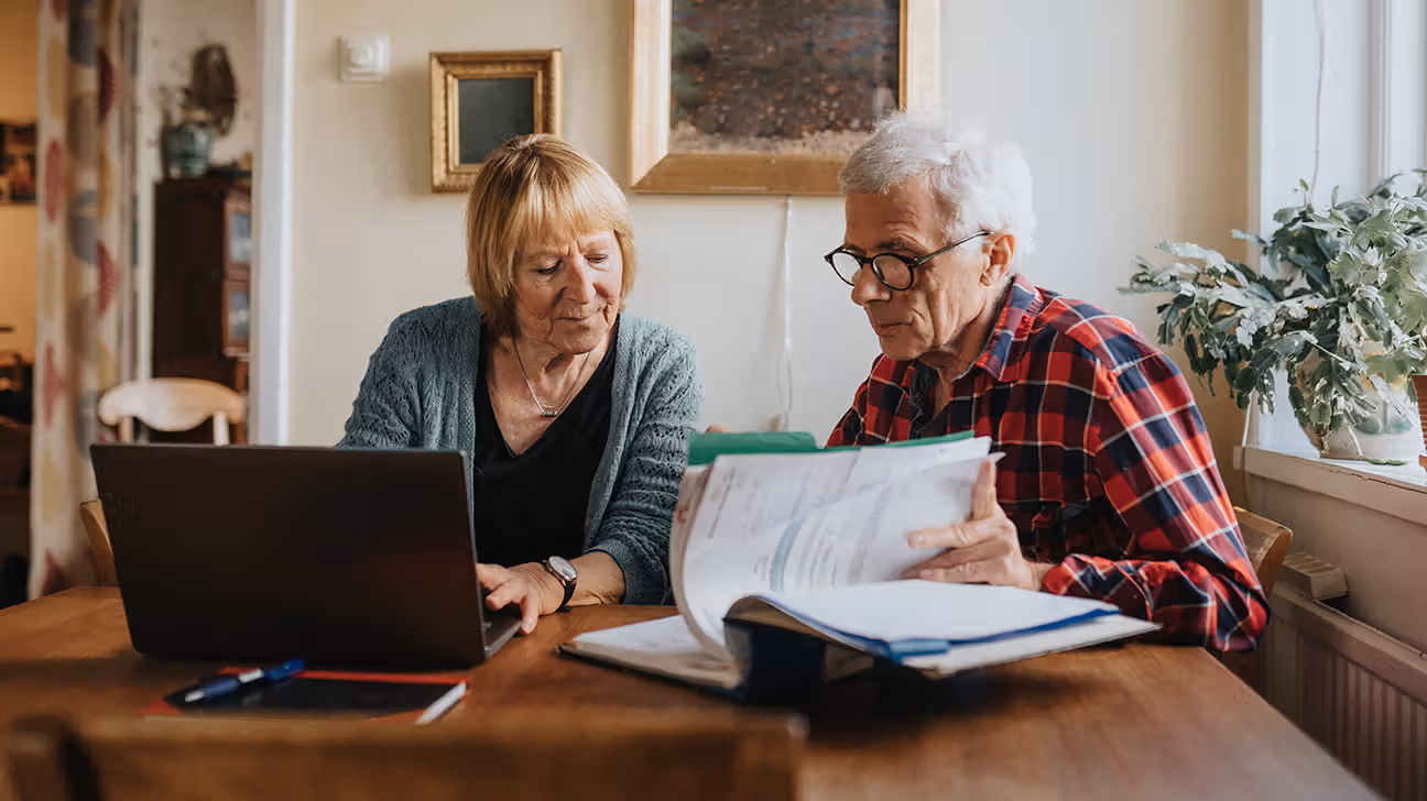 Older couple reviewing Medicare options on laptop