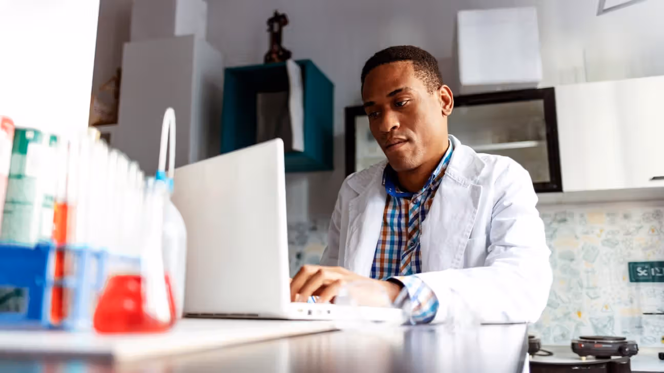 Male doctor reviews cardiovascular test results on laptop