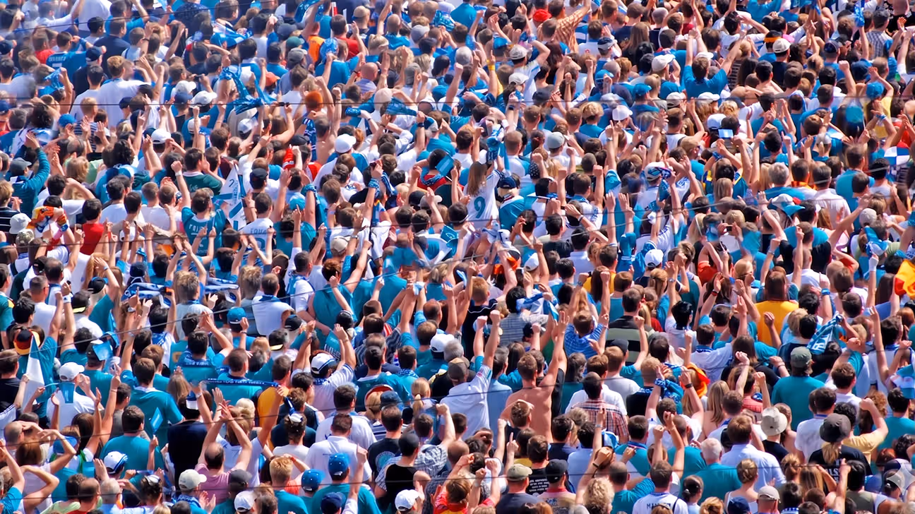 Large gathering of people cheering