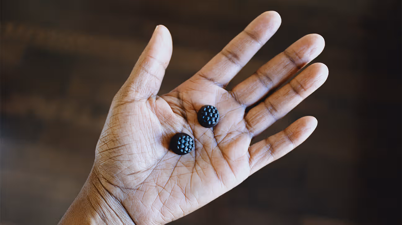 Melatonin gummies in a palm